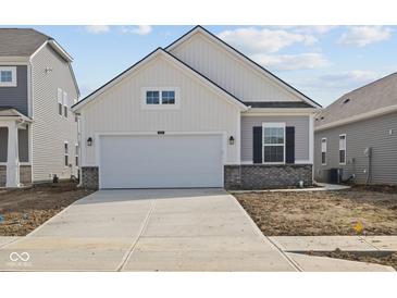 Charming single-Gathering home featuring a two-car garage and light color scheme at 5207 Rolling Meadow Blvd, Indianapolis, IN 46237