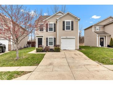 Charming two-story home featuring black shutters, a one-car garage, and a well-maintained front lawn at 8808 Hosta Way, Indianapolis, IN 46113