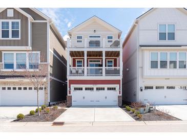 Charming three-story home with a two-car garage and dual balconies for outdoor living at 15391 Mystic Rock Dr, Carmel, IN 46033