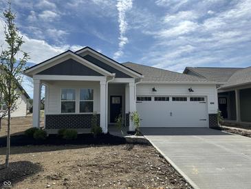 Charming single-story home featuring a brick accent, white siding, and an attached two-car garage at 19727 Boulder Brook Ln, Westfield, IN 46074