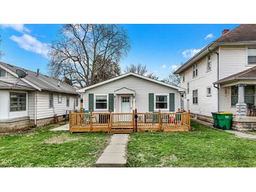 Charming single-story home with a welcoming wood porch and well-maintained lawn at 4933 Ford St, Indianapolis, IN 46224