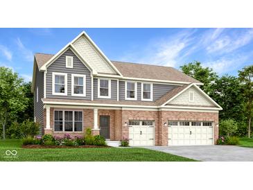 Inviting two-story home with a brick facade, two-car garage, and manicured landscaping at 5279 Pelion Pl, McCordsville, IN 46055