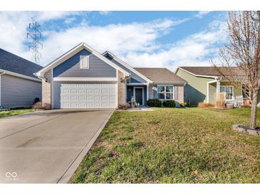 Charming single-story home with a well-manicured lawn and attached two-car garage at 972 Redwood Dr, Franklin, IN 46131