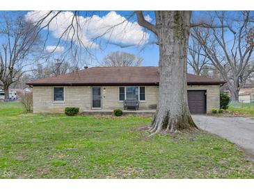 Charming single-story home featuring a stone facade, attached garage, and well-manicured lawn at 1114 S Avon Ave, Avon, IN 46123
