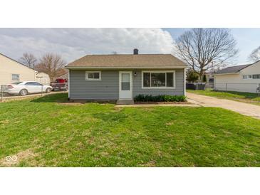 Cozy single-story home with gray siding and a well-manicured lawn and a paved drive at 380 Parkway St, Whiteland, IN 46184