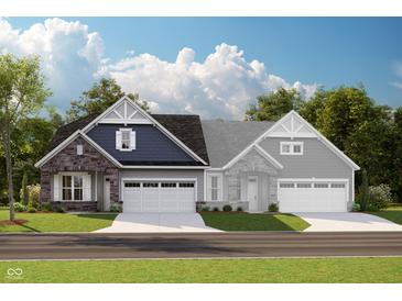 Charming two-story home with stone accents, attached two-car garage, and a well-manicured front lawn at 16955 Cole Evans Dr, Noblesville, IN 46060