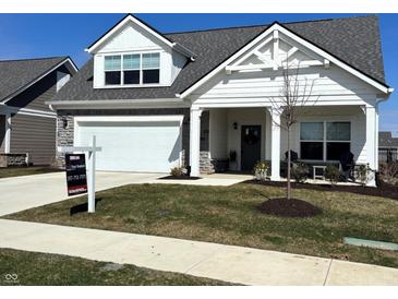 Charming single-Gathering home with a well-manicured lawn, and a welcoming front porch at 2460 Collins Dr, Westfield, IN 46074