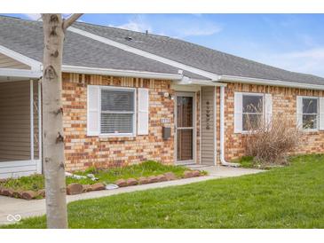 Charming single-story brick home featuring white trim and a well-maintained lawn at 2770 Two Worlds Dr, Columbus, IN 47201