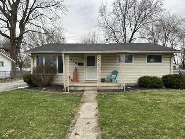 Charming single-story home featuring a cozy front porch, landscaped yard, and inviting entrance at 428 E Trevor St, Brownsburg, IN 46112