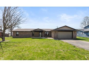 Beautiful brick home with an attached garage and well-manicured front lawn at 153 Terrace Ct, Franklin, IN 46131