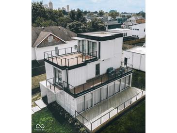 Modern home built from shipping containers featuring multiple decks and large windows at 1802 Bellefontaine St, Indianapolis, IN 46202