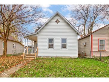 Charming single-Gathering home featuring a quaint front porch and well-maintained lawn at 1911 Wilcox St, Indianapolis, IN 46222