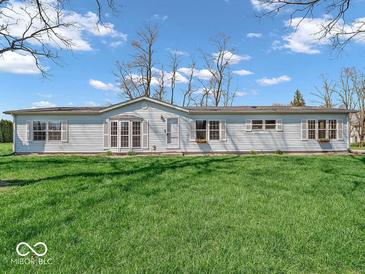 Charming single-story home featuring a spacious yard and classic architectural details at 25249 State Road 13 N, Noblesville, IN 46060