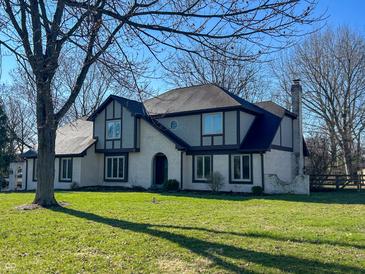 Charming two-story home featuring a well-manicured lawn, brick accents, and architectural details at 7211 Kensington Ct, Avon, IN 46123