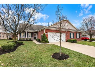 Charming brick home with a well-manicured lawn and a two car garage, perfect for suburban living at 10629 Medinah Dr # 1, Indianapolis, IN 46234