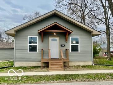 Charming home featuring a covered entryway and a well-maintained lawn at 1100 Graham St, Franklin, IN 46131