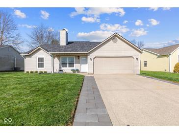 Charming single-story home featuring a well-maintained lawn and attached two-car garage at 1160 Ida Ct, Greenwood, IN 46143