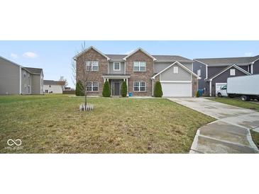 Two-story home featuring a well-maintained lawn and a two-car garage at 1436 Amberwoods Ct, Indianapolis, IN 46239