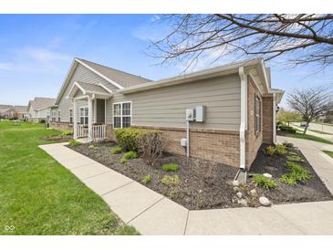 Charming home featuring well-maintained landscaping, a combination of vinyl siding and brick, and a classic roofline at 639 Nuttal St, Westfield, IN 46074