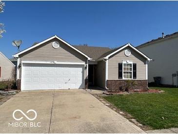 Charming ranch-style home with a two-car garage and well-maintained lawn at 11876 Wapiti Way, Noblesville, IN 46060
