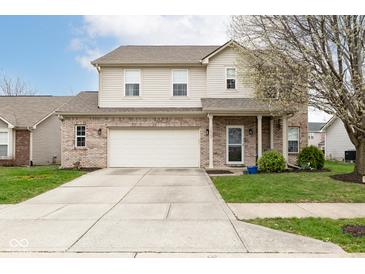 Two-story home with brick and siding, two-car garage, and a well-maintained lawn on a sunny day at 16963 Southall Dr, Westfield, IN 46074