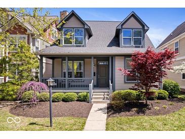 Charming home featuring a covered porch, well-manicured landscaping, and a welcoming facade at 2349 N Delaware St, Indianapolis, IN 46205