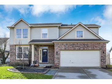 Charming two-story home featuring a brick facade and a well-manicured lawn under a bright, cloudy sky at 3341 Suffolk Ct, Greenwood, IN 46143