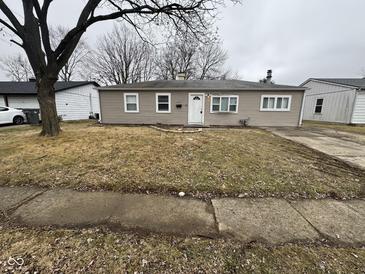 Charming single-story home with a simple front yard and neutral exterior at 3519 N Whitcomb Ave, Indianapolis, IN 46224