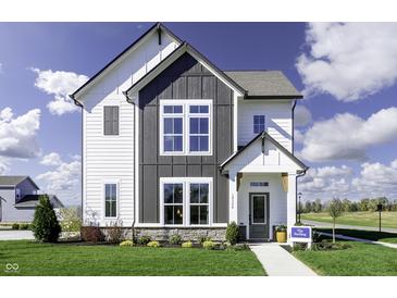 Charming two-story home with a modern farmhouse design and well-manicured lawn at 781 Rose Garden Way, Westfield, IN 46074