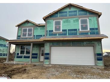 Two-story home under construction, featuring a two-car garage and a covered porch at 221 Ames Dr, Whiteland, IN 46184