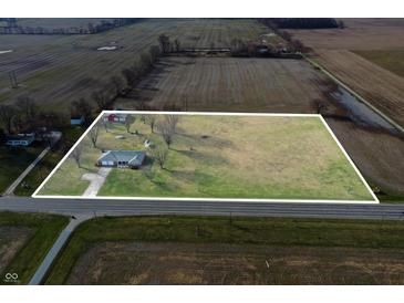 Expansive aerial view of property highlighting home and large lot with clear boundary lines at 4611 E Us Highway 36, Markleville, IN 46056