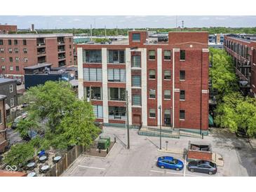 Updated brick building with large windows and parking in downtown neighborhood setting at 624 E Walnut St # 21, Indianapolis, IN 46204