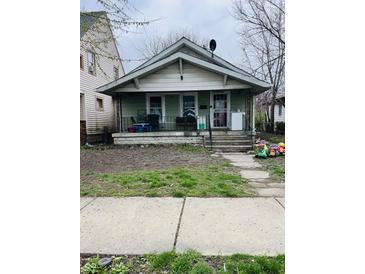 Modest home with a covered porch, showing the front exterior at 918 N Olney St, Indianapolis, IN 46201