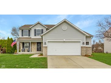 Charming two-story home with a well-maintained lawn, gray siding, and a spacious two-car garage at 11124 Deer Valley Dr, Indianapolis, IN 46229