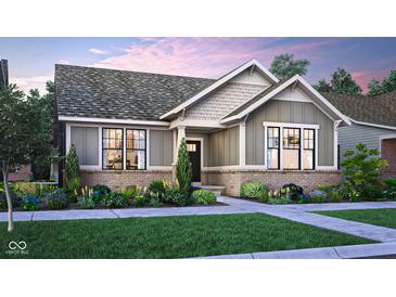 Charming home features a brick foundation, stylish siding, landscaped yard, and inviting entrance at 15384 Cardonia Rd, Fishers, IN 46037