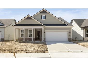 New construction home featuring a front porch and a two-car garage at 5653 Stetson Dr, Whitestown, IN 46052