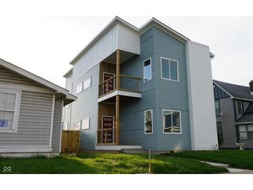Modern two-story home with a unique facade and inviting double-decker balcony at 1026 St Peter St, Indianapolis, IN 46203