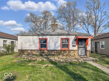 Charming single-story home with stone accents, red window trim, and a cozy front entry at 2429 N Arsenal Ave, Indianapolis, IN 46218