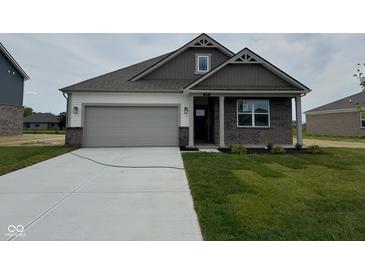 Charming single-story home featuring brick and siding exterior and attached two car garage at 895 Saddlebrook Farms Blvd, Whiteland, IN 46184