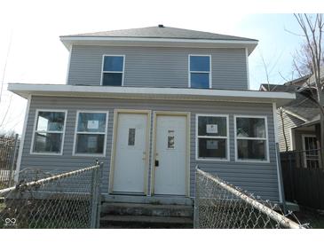Two story home with gray siding, white trim and two front doors at 917 W 27Th St, Indianapolis, IN 46208