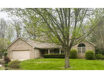Charming brick home featuring an attached garage and a well-maintained front lawn, perfect for suburban living at 2690 Trailridge Ct, Martinsville, IN 46151