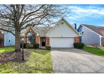 Charming single-Gathering home with a well-manicured lawn and attached two-car garage at 36 Palomino Ct, Zionsville, IN 46077