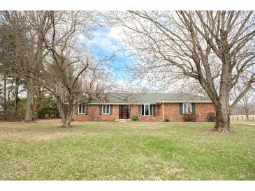 Charming brick ranch home featuring green shutters and a well-maintained front lawn at 3110 S County Road 225 East, Danville, IN 46122