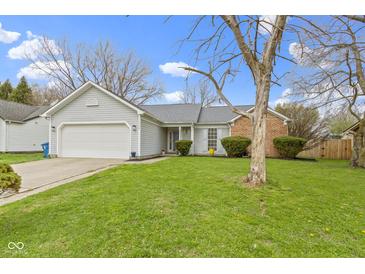 Charming single-story home with a well-manicured front yard and attached two-car garage at 3724 W 42Nd Ter, Indianapolis, IN 46228