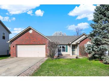 Charming brick home with a well-maintained lawn and attached two car garage at 5426 Black Bear Cir, Indianapolis, IN 46239