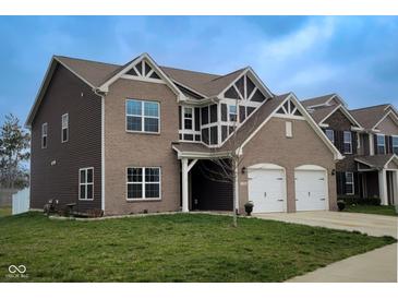 Attractive two-story home with a two-car garage, brick accents, and a well-maintained lawn at 1336 Danielle Rd, Lebanon, IN 46052