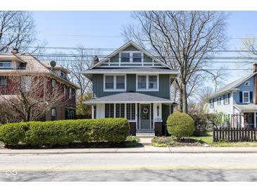 Charming two-story home with a landscaped front yard, well-maintained exterior, and inviting curb appeal at 4030 N Illinois St, Indianapolis, IN 46208