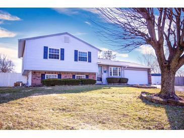 Charming two-story home featuring blue shutters, brick accents and a well-manicured front yard at 535 Butterfly Cir, Greenwood, IN 46142