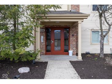 Inviting doorway of home number 1044 showing attractive design and landscaping at 1044 Timber Creek Dr # 4, Carmel, IN 46032