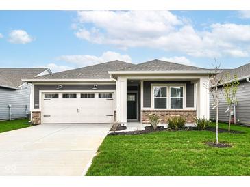 Charming single-story home featuring a two-car garage, landscaped front yard, and neutral-tone exterior at 159 Derringer Ave, Westfield, IN 46074